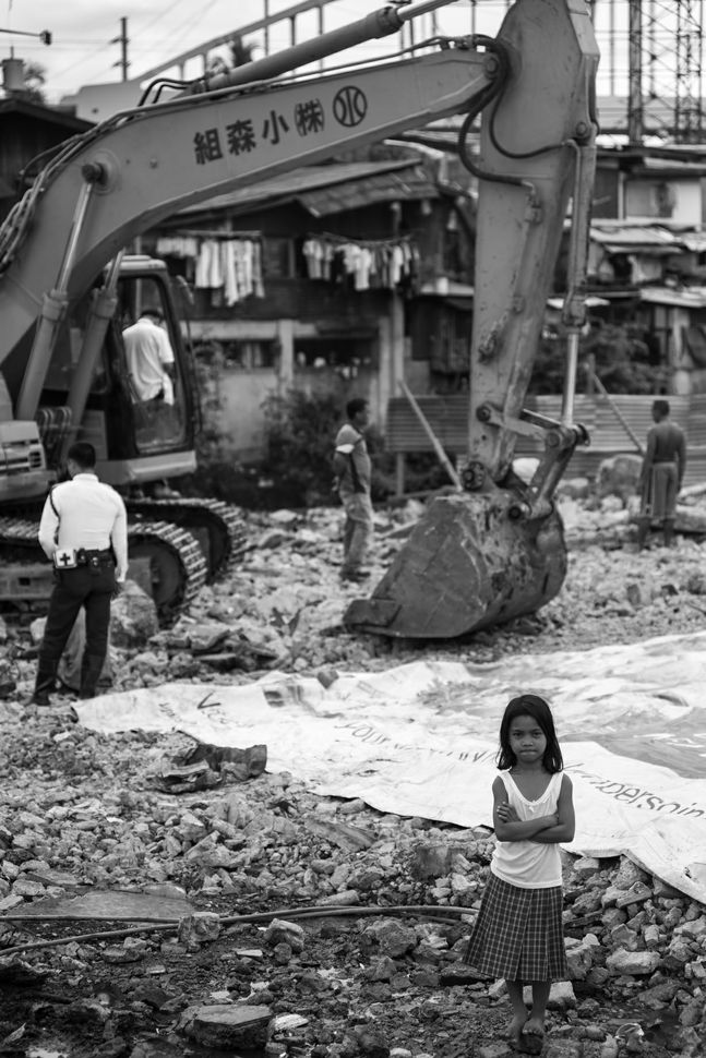 Girl in front of excavator