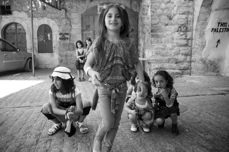 Palestinian girls on the streets of Hebron on Eid day