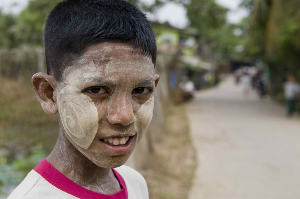 Child with painted face in Dalah