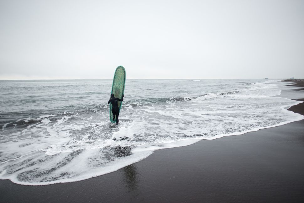 Surfing in Kamtchatka - A brave Russian girl confronts the icy waters of the Pacific in November